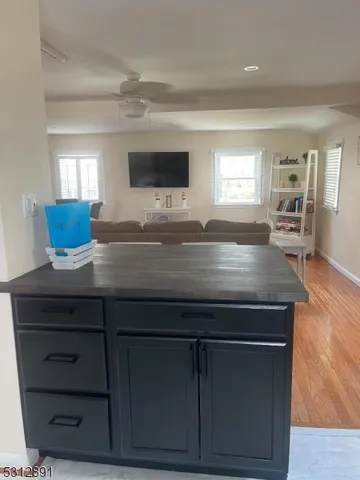 a view of kitchen island with wooden cabinets