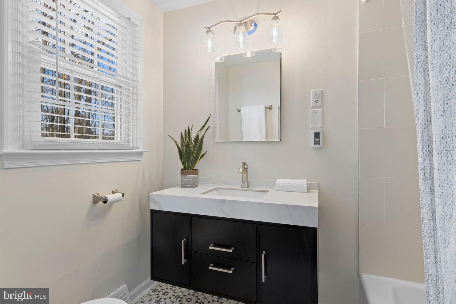 5 Crestview Circle Wayne, PA 19087 - Photo 24 of 38 a bathroom with a sink and a mirror