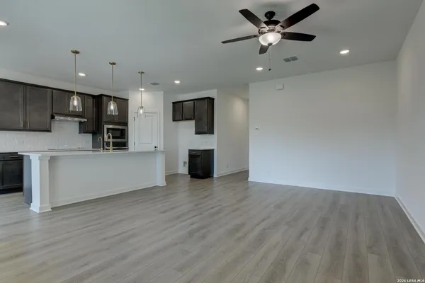 a view of a kitchen with microwave and a stove
