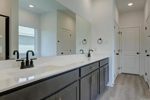 a bathroom with a double vanity sink
