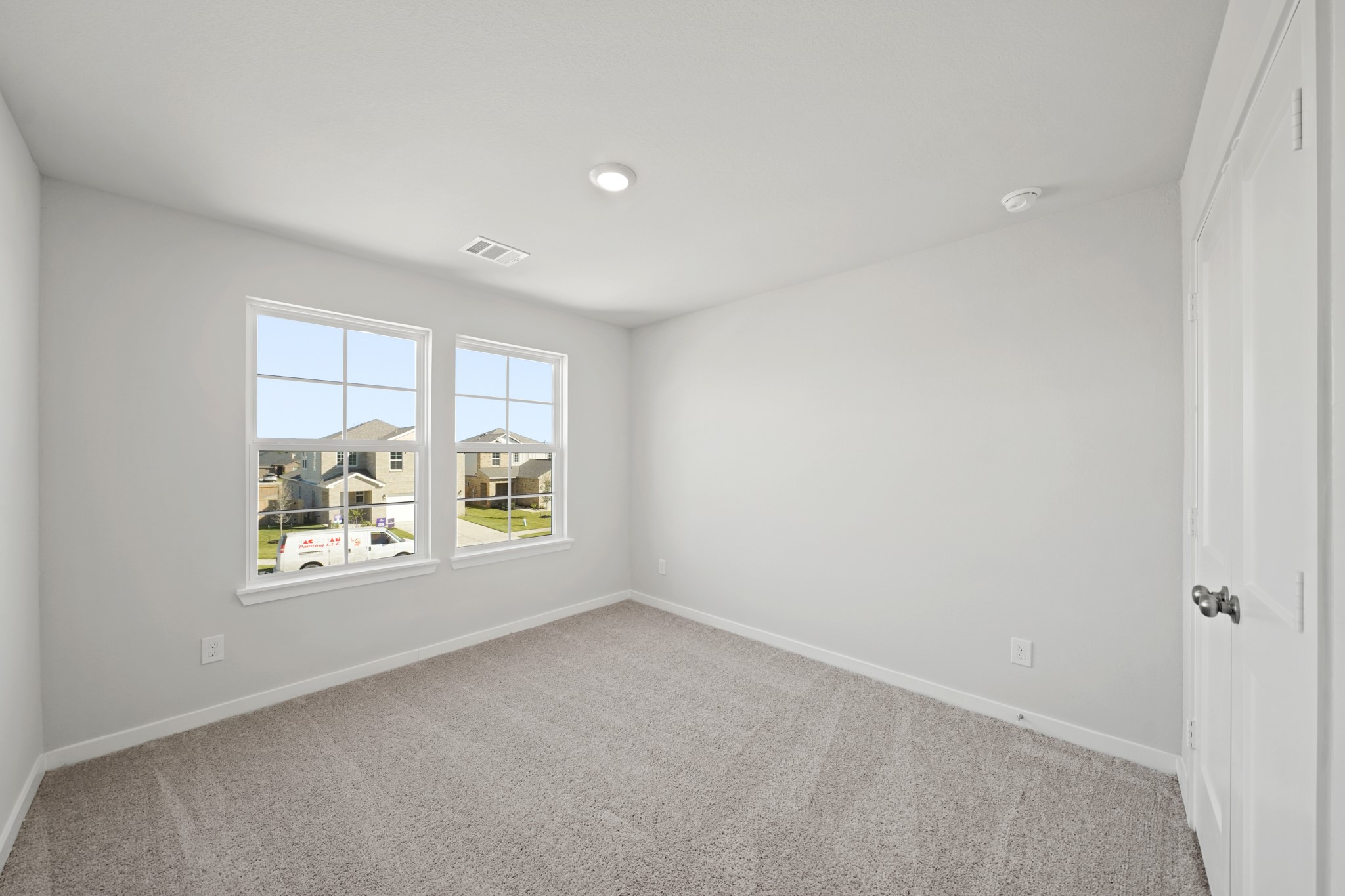 302 Amy Street Angleton, TX 77515 - Photo 13 of 27 an empty room with windows and bed