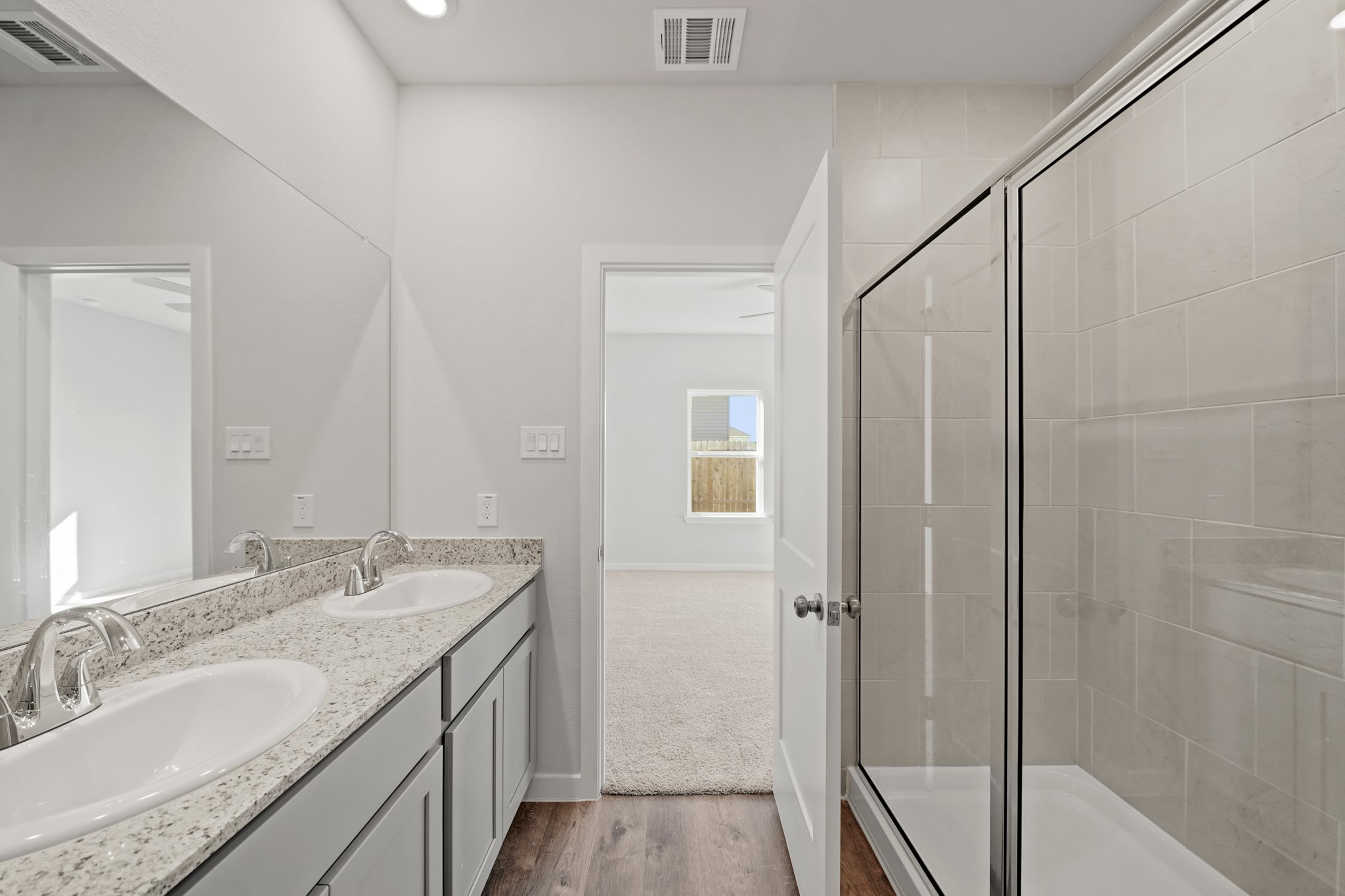 302 Amy Street Angleton, TX 77515 - Photo 9 of 27 a bathroom with a granite countertop sink and a mirror