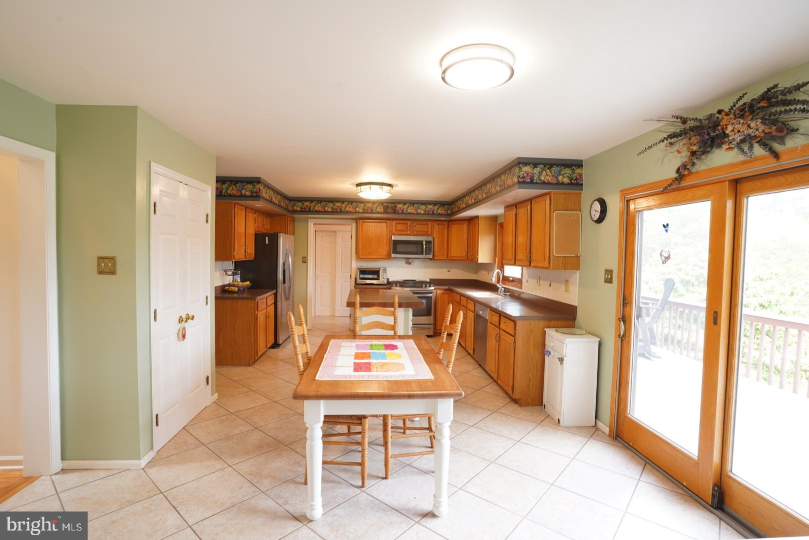 380 Styer Road Glenmoore, PA 19343 - Photo 11 of 33 Bright and inviting kitchen with outdoor access.