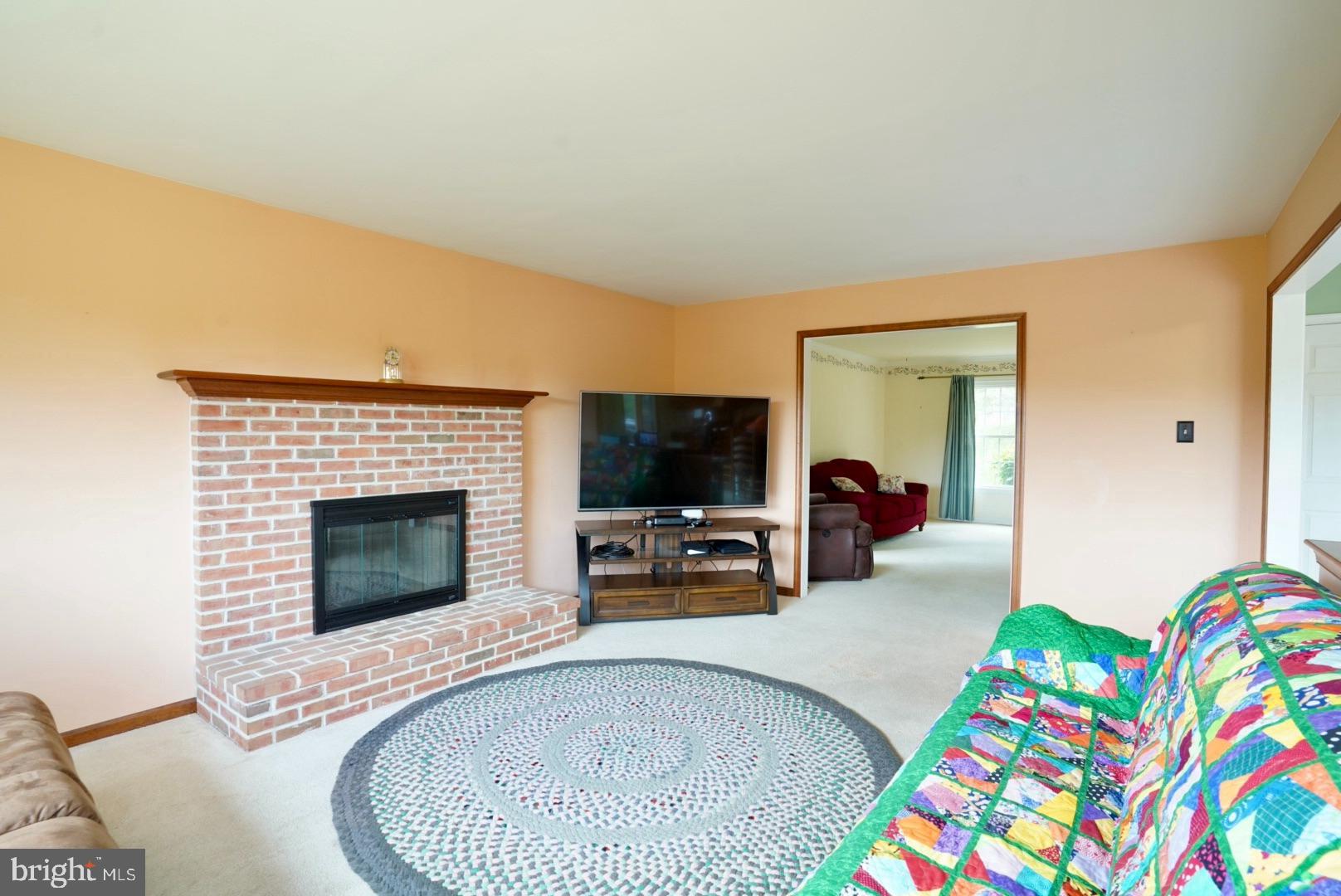380 Styer Road Glenmoore, PA 19343 - Photo 13 of 33 Cozy living space with inviting fireplace.
