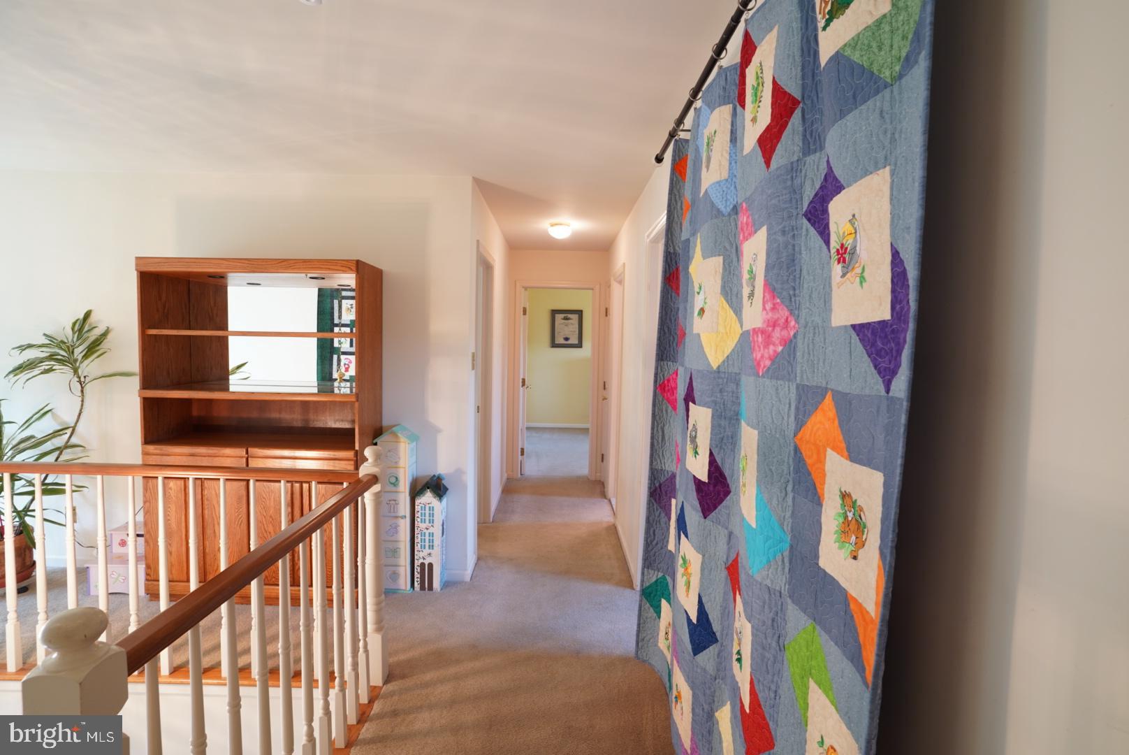 380 Styer Road Glenmoore, PA 19343 - Photo 26 of 33 Colorful quilt adds charm to a cozy hallway.