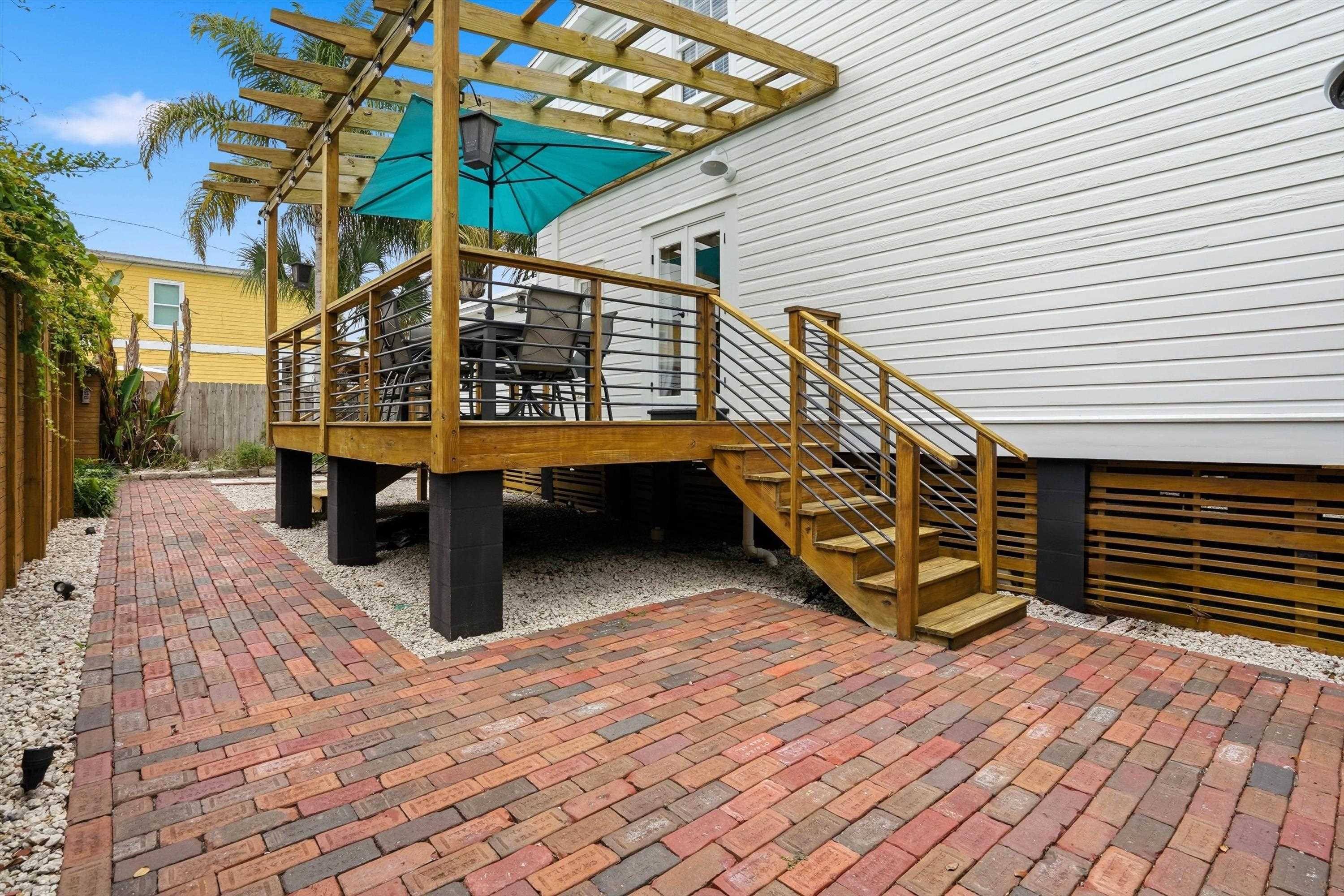 76 Oneida Street St. Augustine, FL 32084 - Photo 32 of 38 a view of balcony with wooden floor and outdoor seating