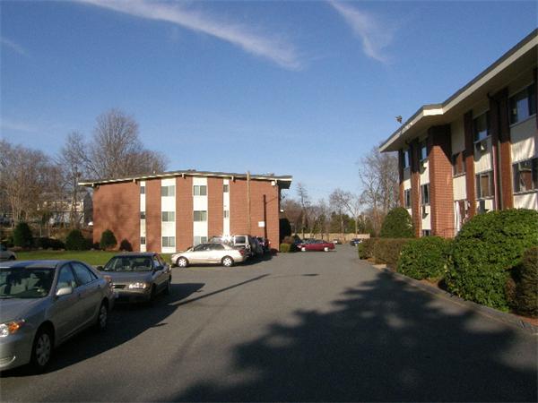 74 Beach Street, Unit 12 Woburn, MA 01801 - Photo 6 of 8 a view of a cars park in front of house