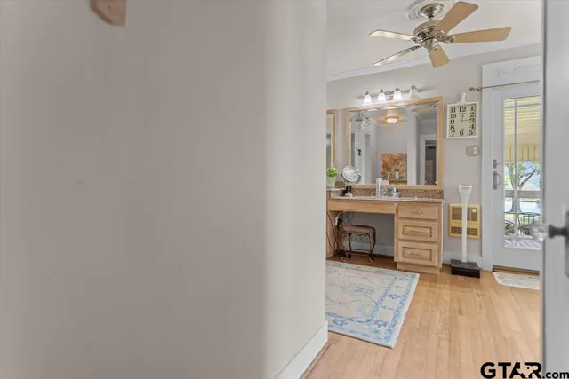 a room with kitchen island and a chandelier