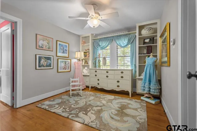 a room with gym equipment and windows