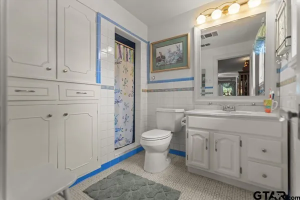 a view of a balcony with wooden floor and windows