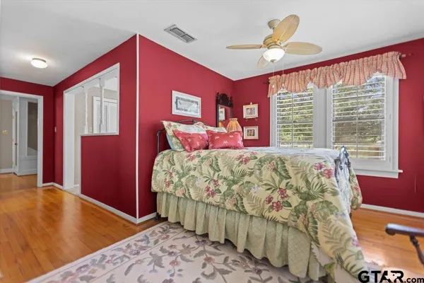 a bed room with a bed and a chandelier