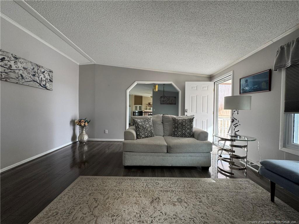100 L Wallace McClean Road Raeford, NC 28376 - Photo 12 of 38 a living room with furniture and a wooden floor