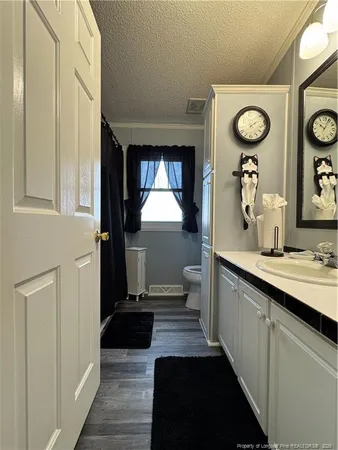 a room with a window and a ceiling fan