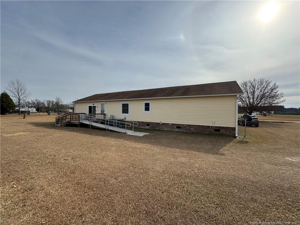 100 L Wallace McClean Road Raeford, NC 28376 - Photo 6 of 38 a view of car parked in parking area