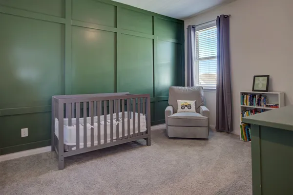 a bedroom with furniture and a window