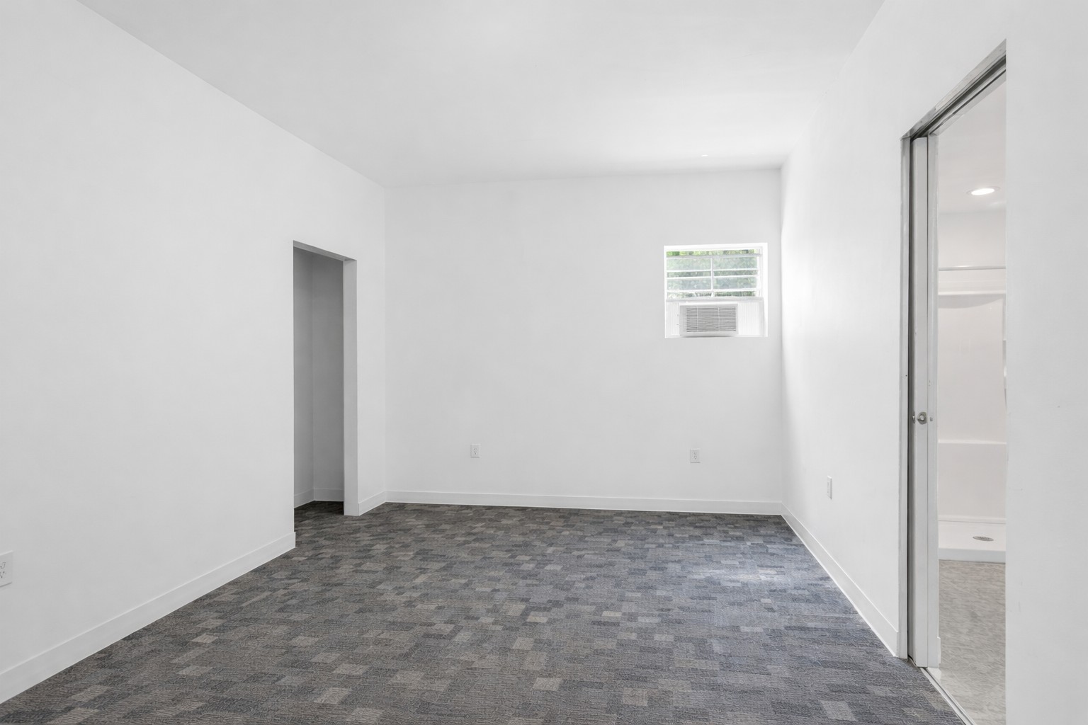 224 Old Coach Lane Elgin, TX 78621 - Photo 14 of 25 This versatile room features white walls, patterned gray carpeting, and a window with blinds