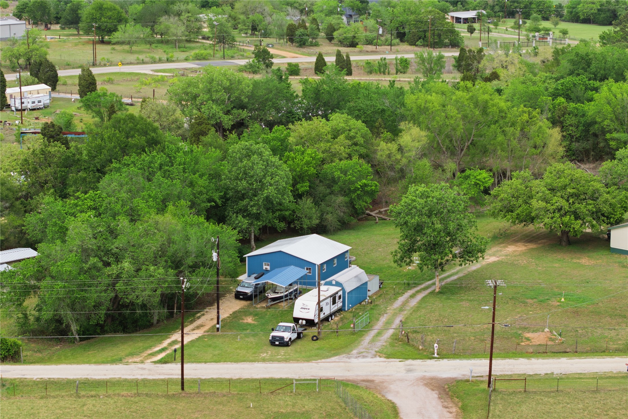 224 Old Coach Lane Elgin, TX 78621 - Photo 20 of 25 Overview of rural landscape with a tree filled landscape