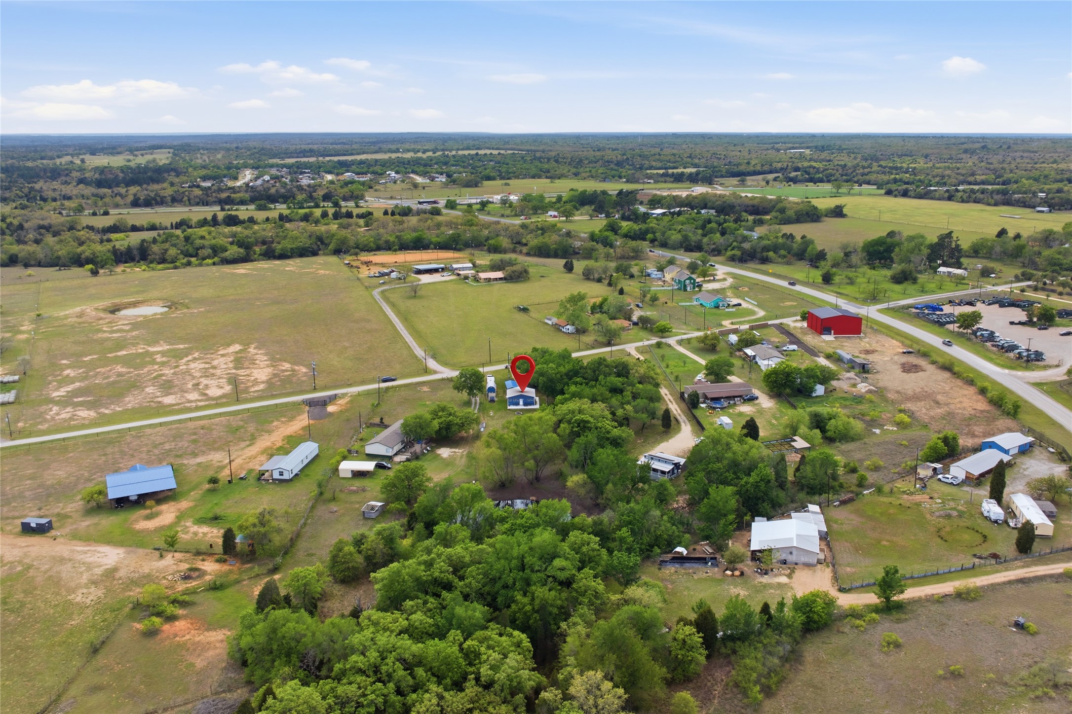 224 Old Coach Lane Elgin, TX 78621 - Photo 21 of 25 Aerial view of property and surrounding area featuring rural landscape