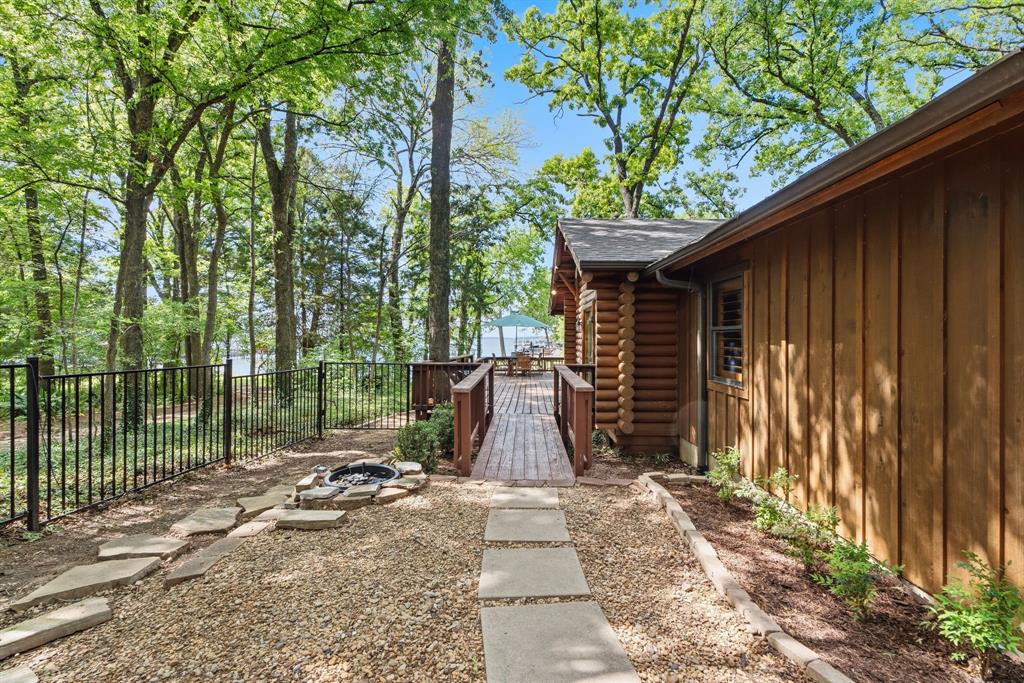 114 Trails End Mabank, TX 75156 - Photo 11 of 40 a view of backyard with a small cabin