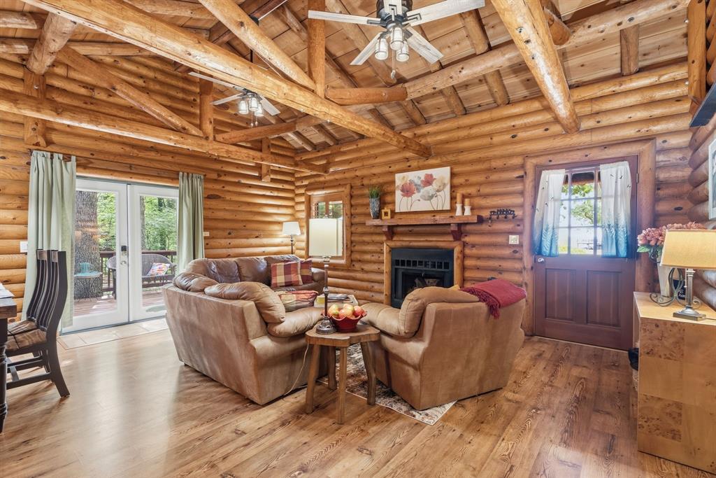 114 Trails End Mabank, TX 75156 - Photo 13 of 40 a living room with fireplace furniture and a wooden floor