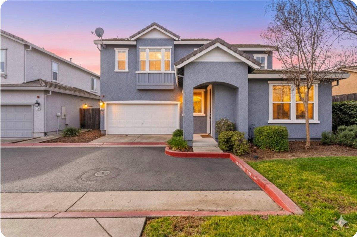 a front view of a house with garage