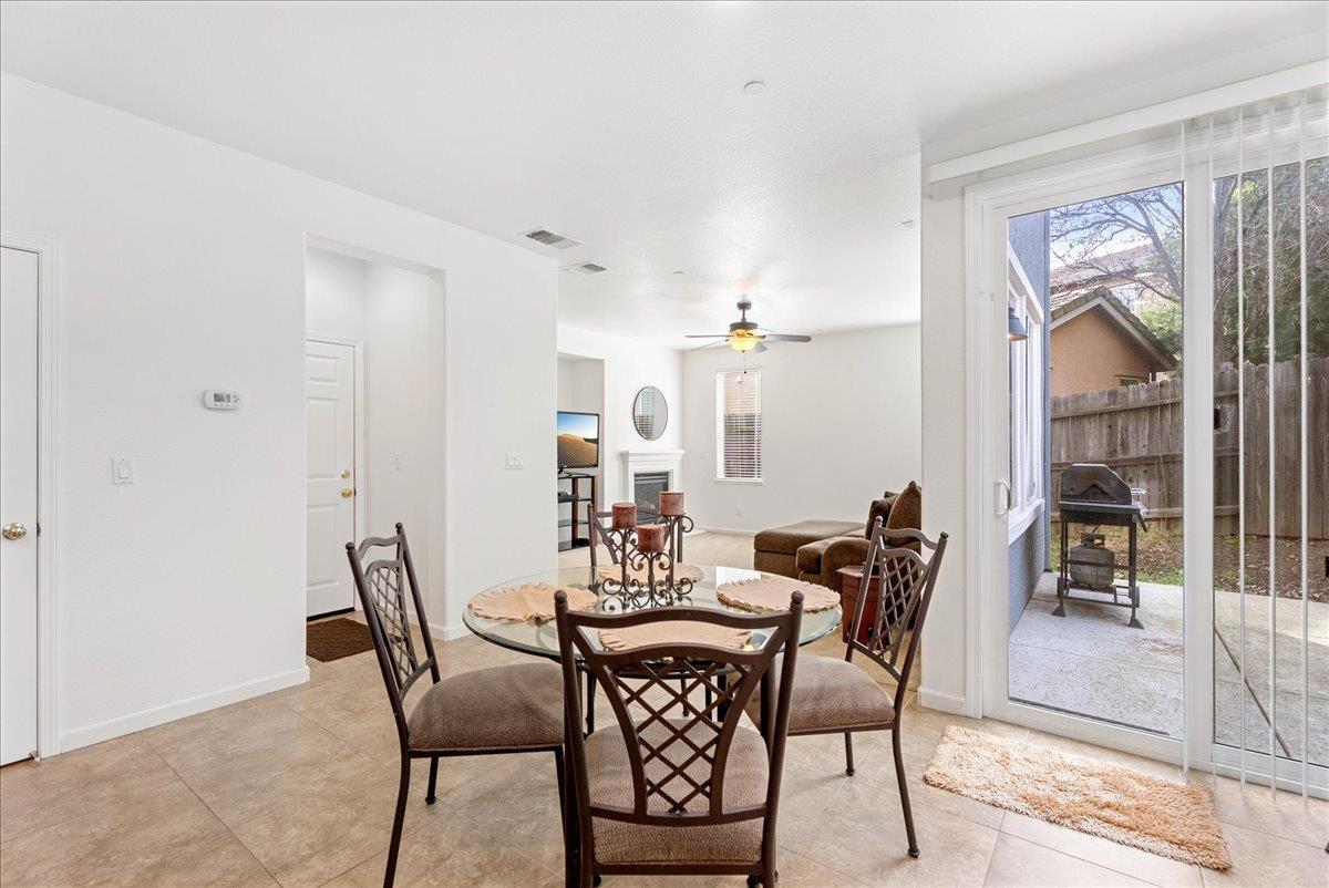 719 Courtyards Loop Lincoln, CA 95648 - Photo 14 of 33 a view of a dining room with furniture and a potted plant