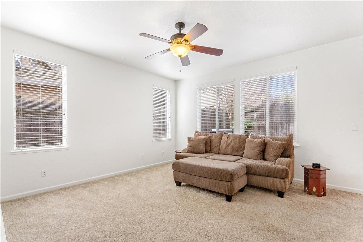 719 Courtyards Loop Lincoln, CA 95648 - Photo 15 of 33 a living room with furniture and a large window