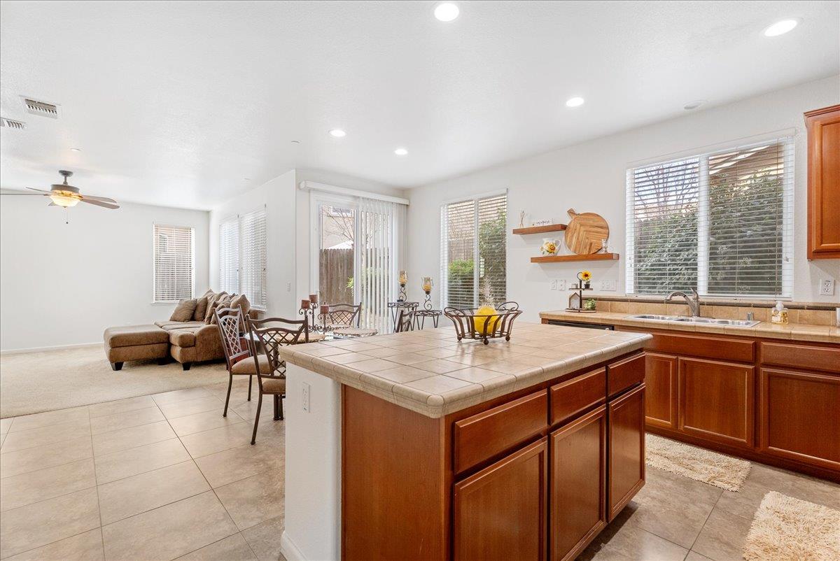 719 Courtyards Loop Lincoln, CA 95648 - Photo 19 of 33 a room with sink table and chairs