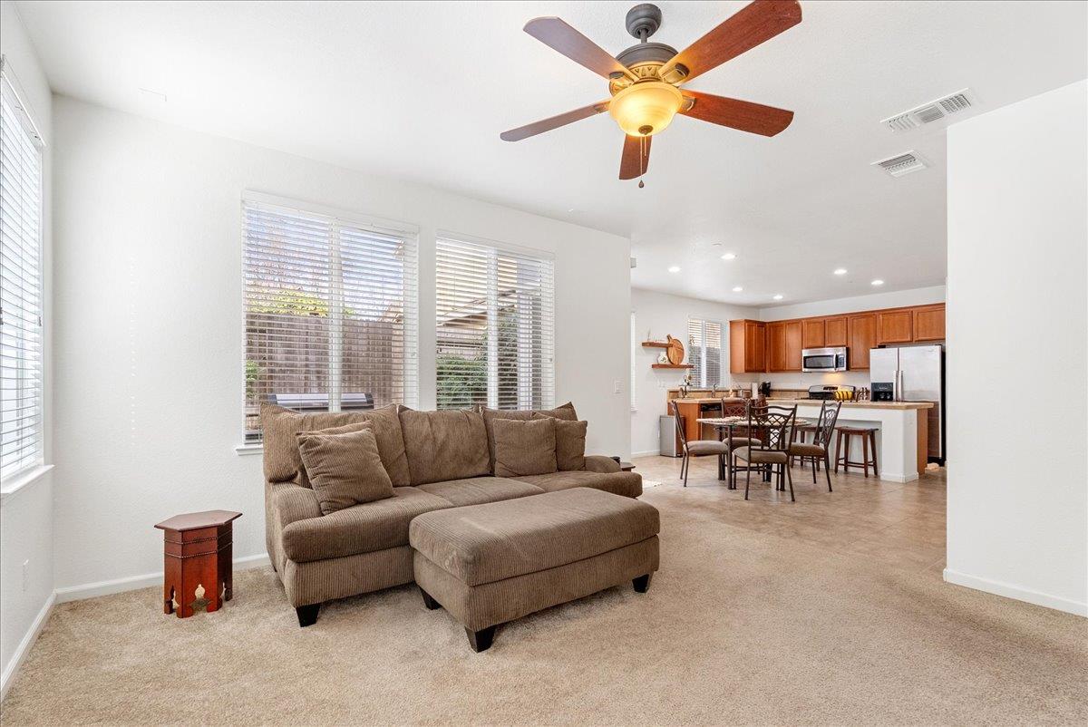 719 Courtyards Loop Lincoln, CA 95648 - Photo 21 of 33 a living room with furniture and a large window