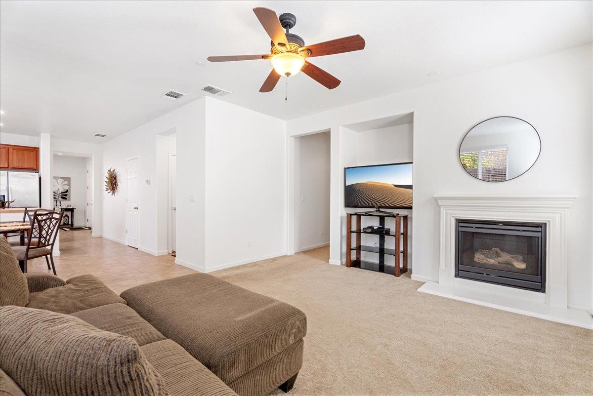 719 Courtyards Loop Lincoln, CA 95648 - Photo 22 of 33 a living room with furniture and a fireplace