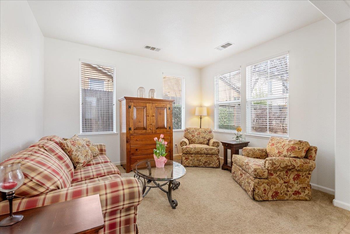 719 Courtyards Loop Lincoln, CA 95648 - Photo 8 of 33 a living room with furniture and a large window