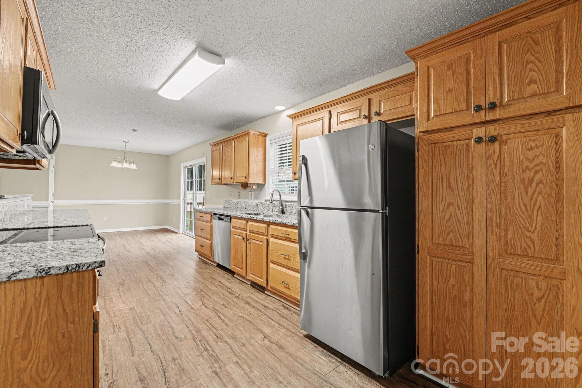 134 Clearview Road Statesville, NC 28625 - Photo 13 of 16 a kitchen with stainless steel appliances granite countertop a refrigerator a sink and dishwasher