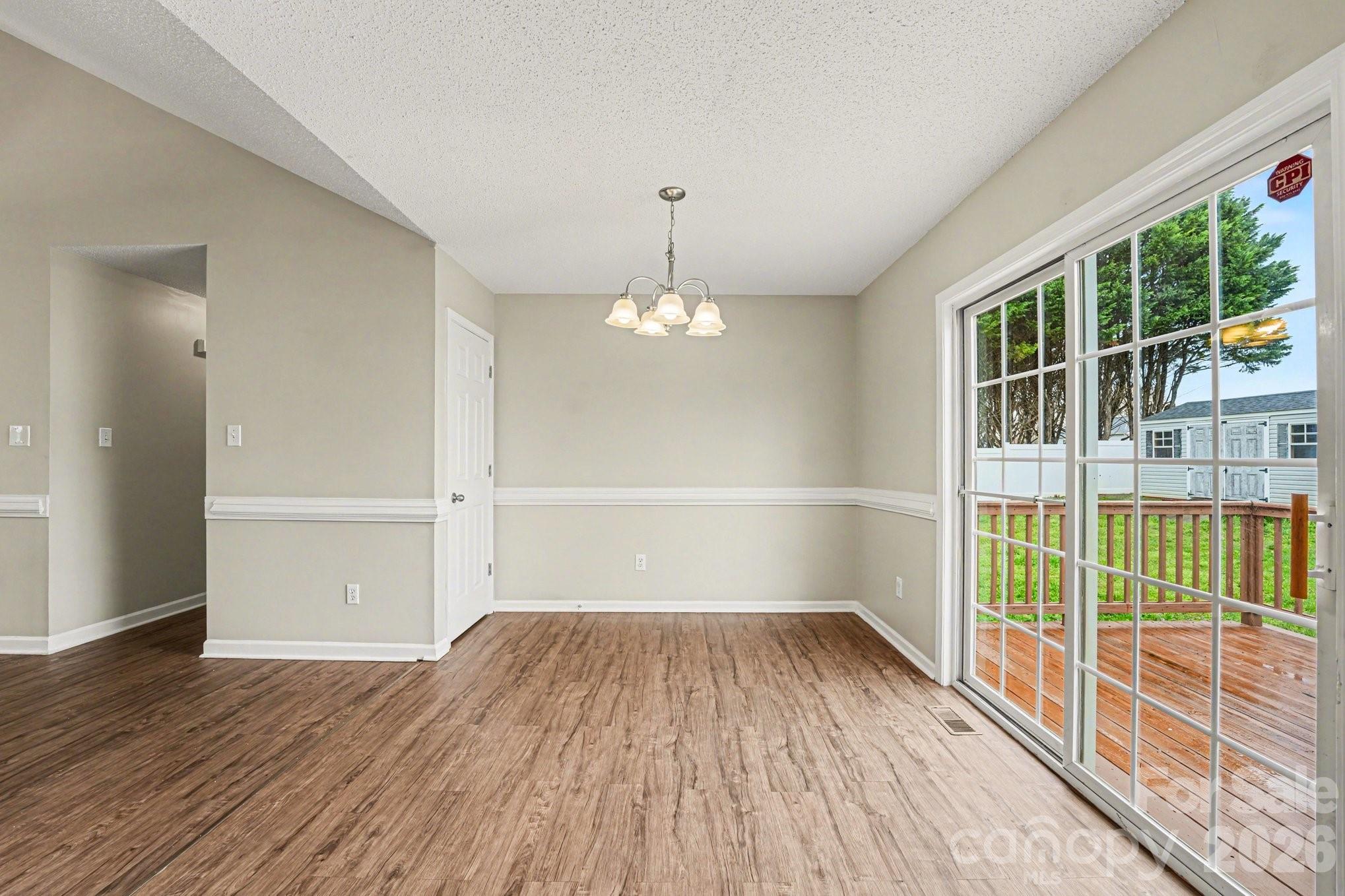 134 Clearview Road Statesville, NC 28625 - Photo 5 of 16 wooden floor in an empty room with a window