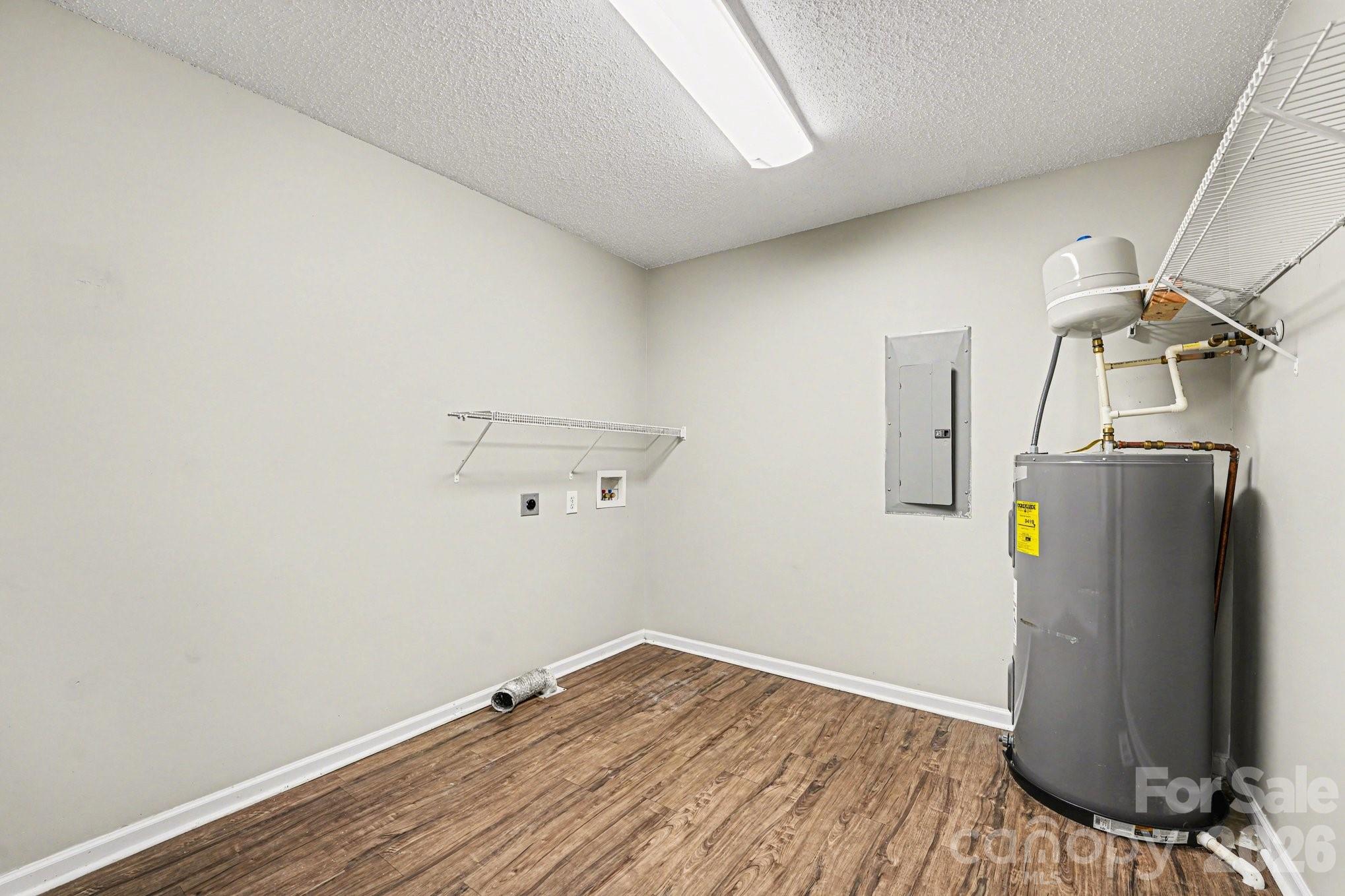 134 Clearview Road Statesville, NC 28625 - Photo 6 of 16 a view of a storage & utility room with wooden floor