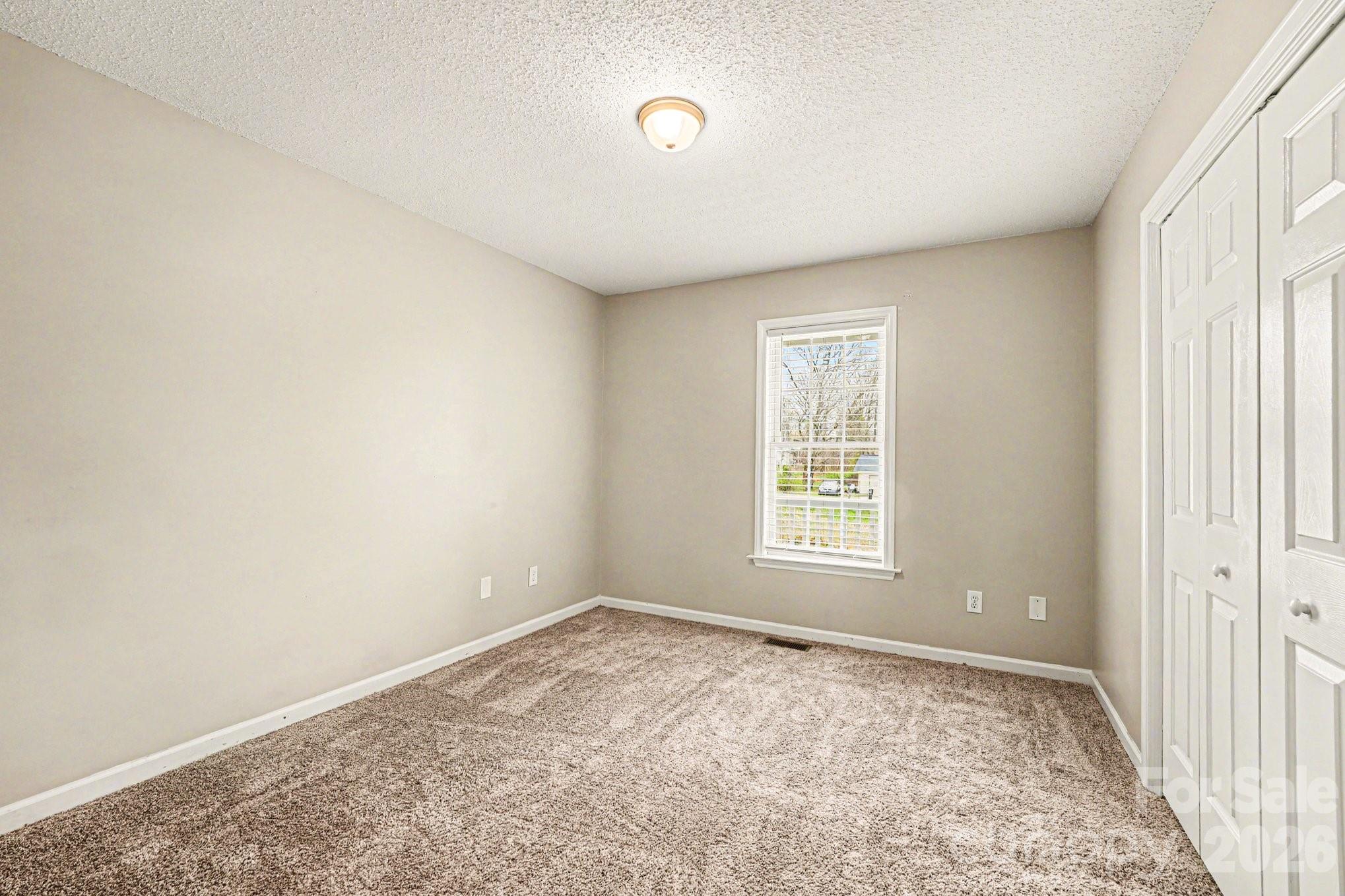 134 Clearview Road Statesville, NC 28625 - Photo 7 of 16 an empty room with windows