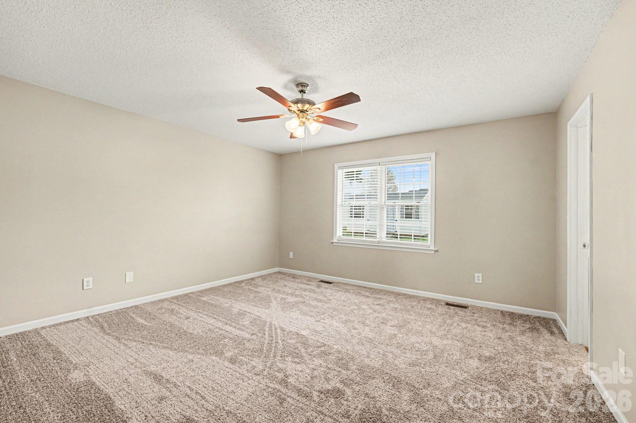 134 Clearview Road Statesville, NC 28625 - Photo 8 of 16 a view of an empty room with a window