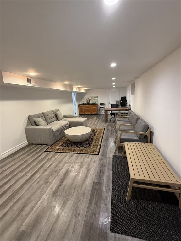 40 Michael Street, Unit 4 Arlington, MA 02474 - Photo 2 of 4 a living room with furniture and a wooden floor