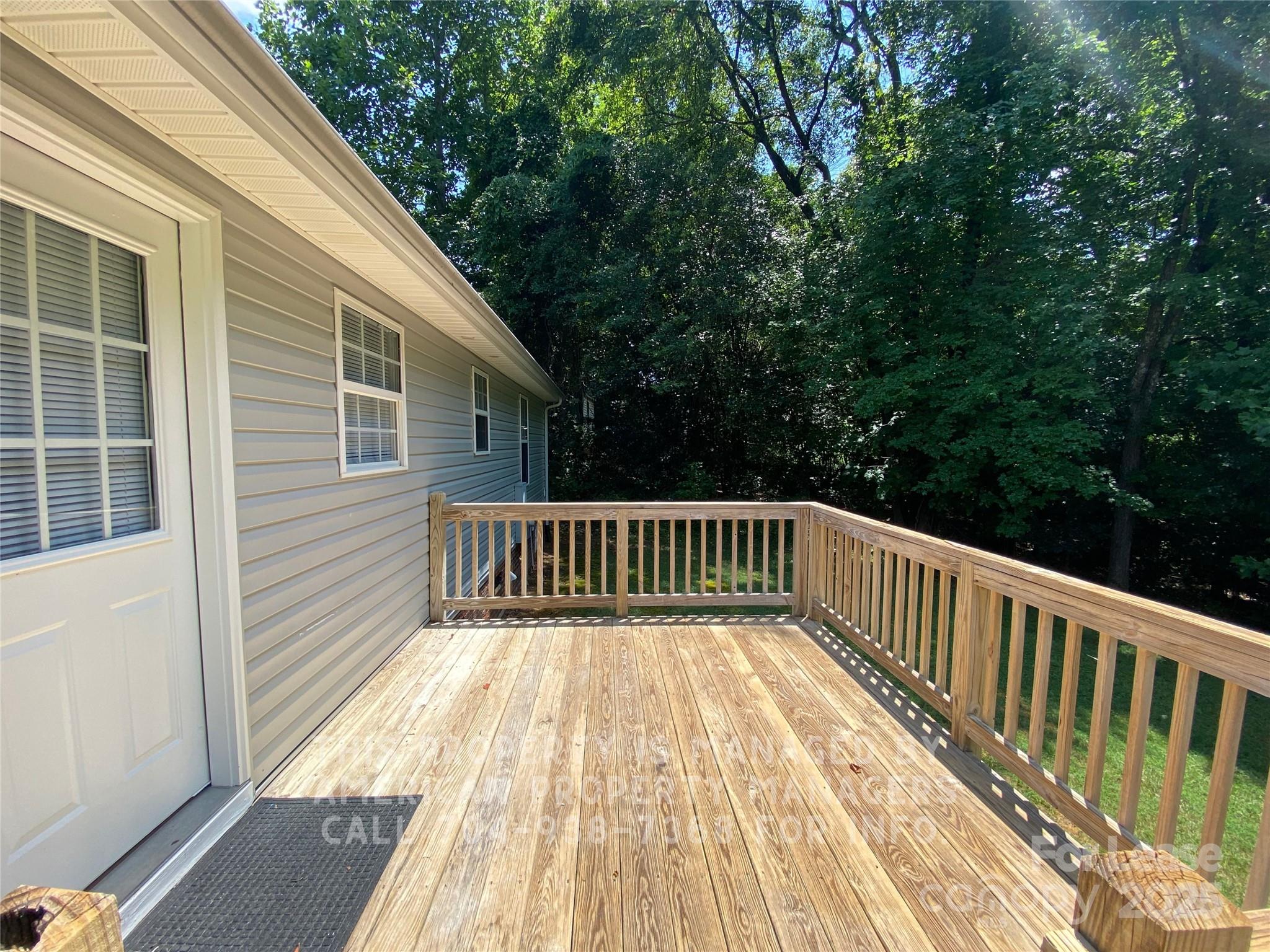 41 Ridge Court Southeast Concord, NC 28025 - Photo 13 of 14 a view of balcony with wooden floor and fence