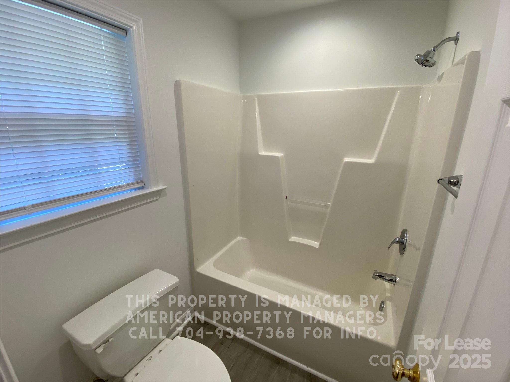 41 Ridge Court Southeast Concord, NC 28025 - Photo 8 of 14 a bathroom with a shower and a toilet