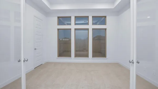 an empty room with windows