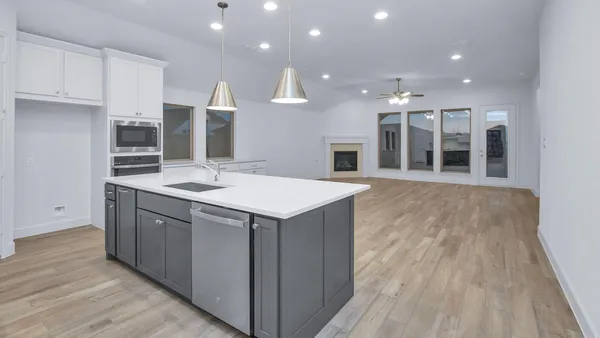 a bathroom with a sink and a large mirror