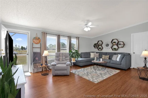 a living room with furniture and a large window