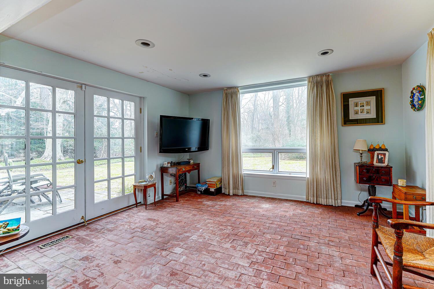 323 Caversham Road Bryn Mawr, PA 19010 - Photo 19 of 52 Sun Room with Brick Floor Overlooking Back Yard