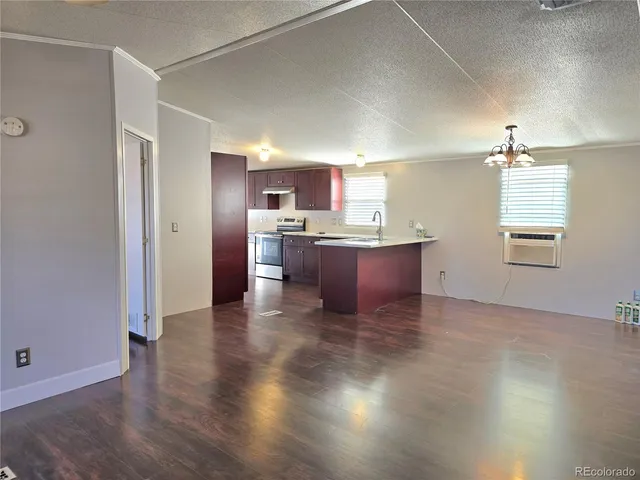a view of kitchen with wooden floor and window