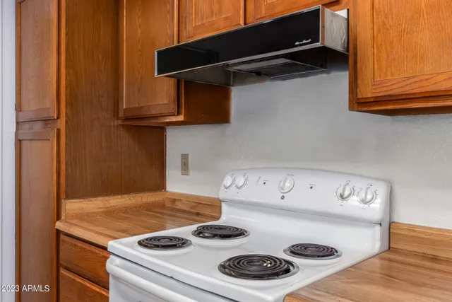 a kitchen with a stove and a microwave