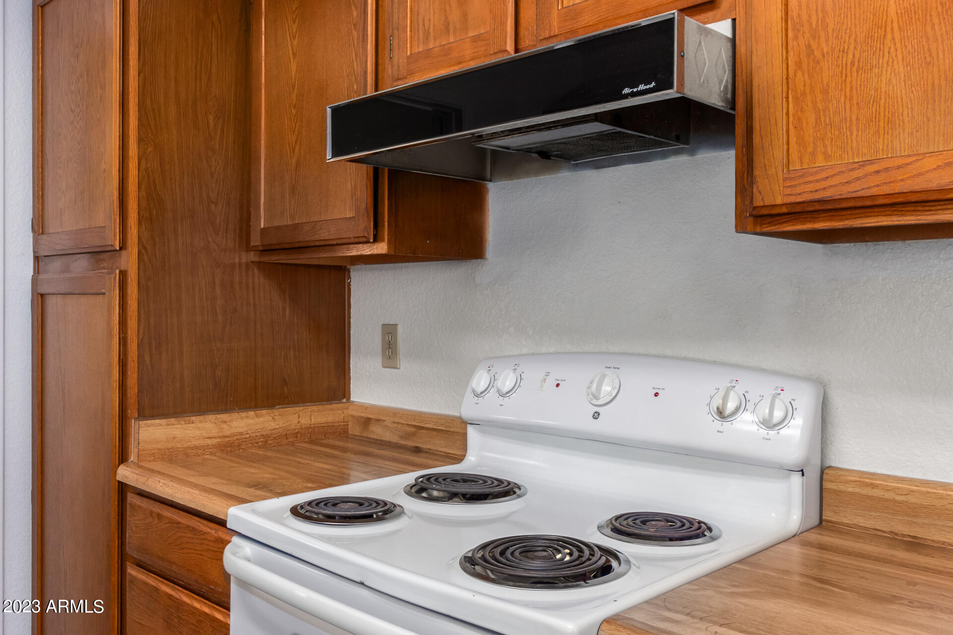 7331 West Paradise Drive Peoria, AZ 85345 - Photo 12 of 27 a kitchen with a stove and a microwave