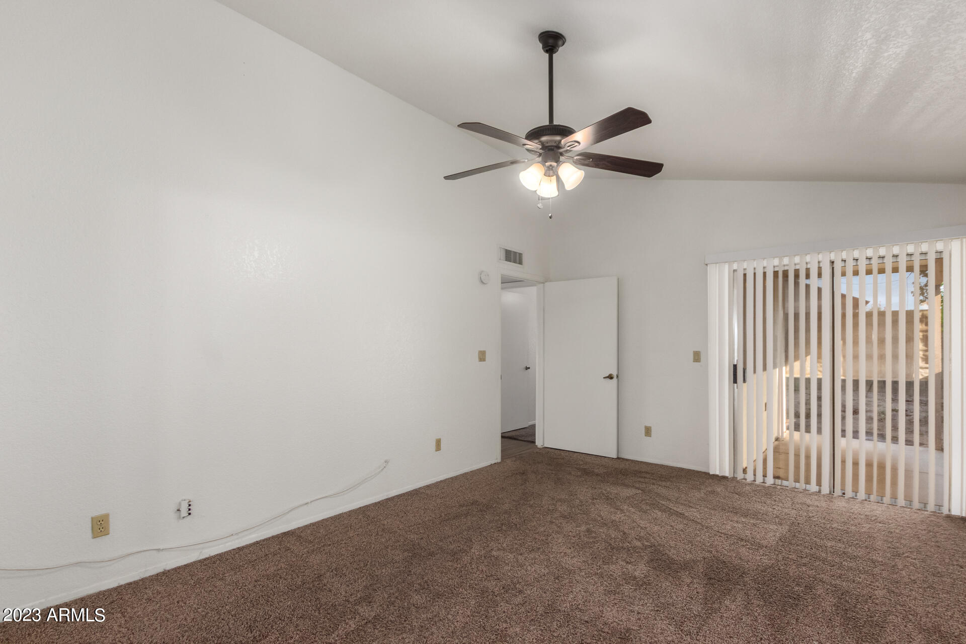 7331 West Paradise Drive Peoria, AZ 85345 - Photo 16 of 27 en view of a livingroom with a ceiling fan and window