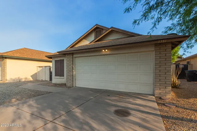 a front view of a house with a garage
