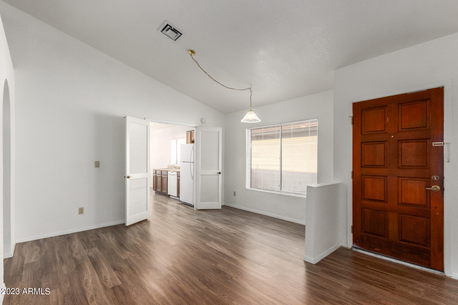 7331 West Paradise Drive Peoria, AZ 85345 - Photo 3 of 27 an empty room with wooden floor and closet