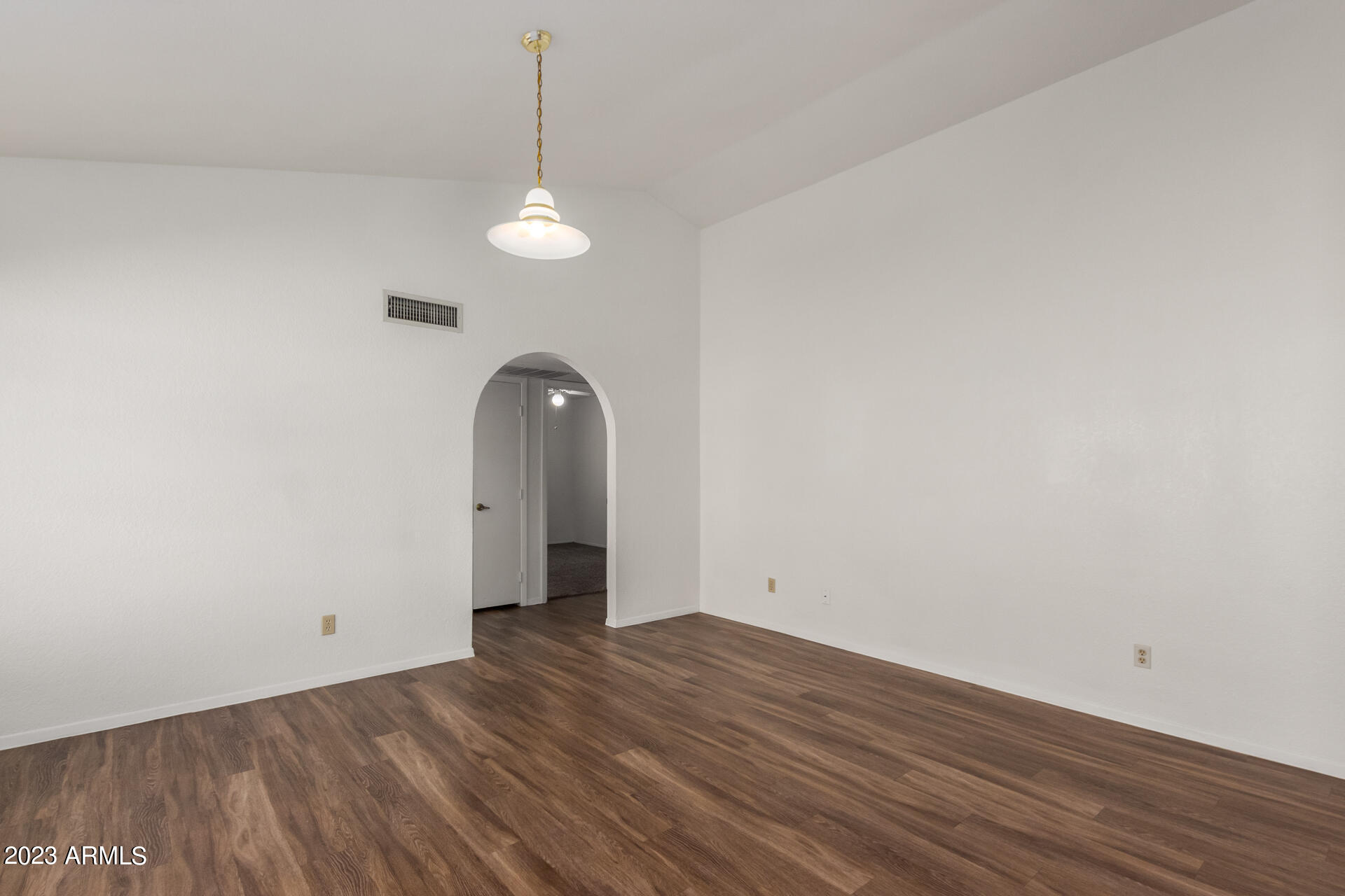 7331 West Paradise Drive Peoria, AZ 85345 - Photo 6 of 27 a view of a room with wooden floor and ceiling fan